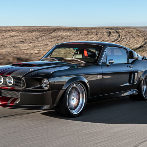 Carbon Fiber 1967 Shelby GT500CR driving on a track