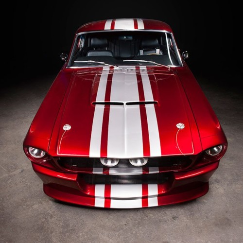 Red car with white stripes and